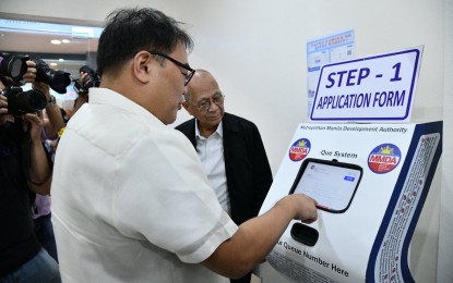 <p><strong>MMDA SATELLITE OFFICE.</strong> Metropolitan Manila Development Authority (MMDA) acting chair Don Artes (left) tries one of the kiosks at the launch of the MMDA satellite office at Robinson's Galleria Ortigas on Monday (Sept. 16, 2024). The satellite office accepts payments for fines issued by the MMDA as well as processing of other documents. <em>(Photo courtesy of MMDA)</em></p>