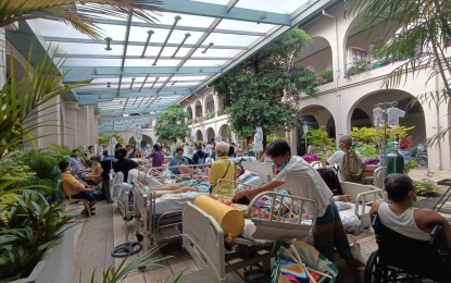 <p><strong>EVACUATED.</strong> Some patients on beds, stretchers and wheelchairs at the Outpatient Department of the University of the Philippines - Philippine General Hospital were evacuated on Monday (Sept. 16, 2024) following a fire that broke out from a room on the second floor. The fire was put out at 7:08 a.m.<em> (Photo courtesy of Manila Disaster Risk Reduction and Management Office)</em></p>