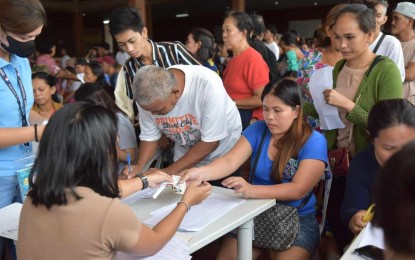 <p><strong>PAYOUT.</strong> Beneficiaries of the Tulong Panghanapbuhay sa Ating Disadvantaged/Displaced Workers (TUPAD) program receive their financial assistance in Dumaguete City on Tuesday (Sept. 17, 2024). The Department of Labor and Employment is releasing over PHP10.7 million to 2,288 workers in the city. <em>(Photo courtesy of Dumaguete CIO)</em></p>