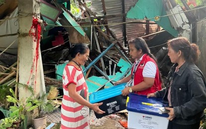 <p><strong>ASSISTANCE.</strong> Department of Social Welfare and Development personnel deliver relief goods to families affected by the weather disturbance in Nabas, Aklan on Tuesday (Sept. 17, 2024). The inclement weather displaced over 15,000 families in Western Visayas. <em>(Photo courtesy of Larne Tamonan/DSWD)</em></p>