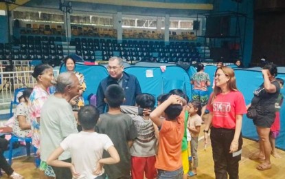 <p><strong>EVACUATION.</strong> Bago City Mayor Nicholas Yulo, with City Social Welfare and Development officer Leah Pilipina Canayon (2nd from right), visits the evacuees at the Manuel Y. Torres Memorial Coliseum and Cultural Center over the weekend. As of Tuesday (Sept. 17, 2024), 1,820 families displaced by floods in the city have been staying in various evacuation centers. <em>(Photo courtesy of Bago City Information Office)</em></p>