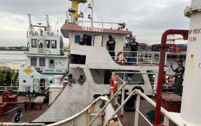 <p><strong>SEIZED.</strong> Fuel tanker MT Tritrust is seized by Customs officers during an operation at the Navotas Fish Port on Wednesday (Sept. 18, 2024). The BOC on Thursday (Sept. 19) said MT Tritrust and another fuel tanker MT Mega Ensoleilee yielded 370,000 liters of unmarked fuel worth PHP20.35 million.<em> (Photo courtesy of BOC)</em></p>