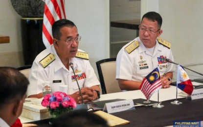 <p><strong>PARTNERS.</strong> PN Vice Commander, Rear Admiral Jose Ma. Ambrosio Ezpeleta (right) and Rear Adm. Farizal Myeor, Asst. Chief of Staff for Operations and Training, RMN, lead the Philippines and Malaysia's 26th Navy-to-Navy Talks (N2NT) in Makati City on Wednesday (Sept. 18, 2024). The two navies committed to promoting regional stability and upholding maritime safety. <em>(Photo courtesy of the PN)</em></p>