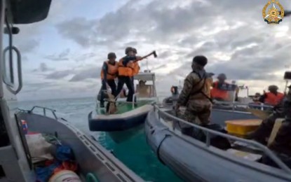 <p><strong>HARASSMENT. </strong>China Coast Guard (CCG) personnel point bladed weapons on Filipino troops carrying out a humanitarian rotation and resupply mission to the BRP Sierra Madre in Ayungin Shoal on June 17, 2024. TNational Maritime Council spokesperson (ret.) Vice Adm. Alexander Lopez said Thursday (Sept. 19) that Philippines is open to accepting any grants from its foreign allies to acquire additional maritime assets aimed at improving the country’s ability to patrol the West Philippine Sea (WPS). <em>(Screengrab from video courtesy of the Armed Forces of the Philippines)</em></p>