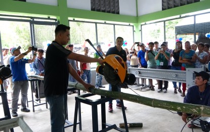 <p><strong>PRODUCT DEVELOPMENT</strong>. Personnel of the Department of Agriculture demonstrate the use of one of the machines turned over to a farmers' group in Camarines Sur on Tuesday (Sept. 17, 2024).  A total of PHP6.2 million worth of facility and machinery for making bamboo products was distributed to the Samahang Organisasyong pang Kalikasan (SOK).<em> (Photo courtesy of DA-Bicol)</em></p>