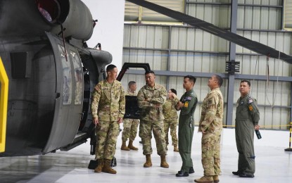 <p><strong>EXPERT EXCHANGE. </strong>PAF and HING personnel on a practical discussion regarding PAF’s S-70i "Black Hawk" helicopter during the five-day SMEE held at the Brig. Gen. Benito N. Ebuen Air Base in Mactan, Cebu. The Philippine Air Force on Friday (Sept. 20, 2024) said the activity also aimed to improve the PAF's interoperability and maximize the capabilities of its S-70i helicopters in order to support various operations of the Armed Forces of the Philippines. <em>(Photo courtesy of the PAF)</em></p>