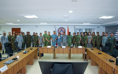 <p><strong>DISASTER RESPONSE COOPERATION.</strong> Participants from the Armed Forces of the Philippines (AFP) and the Singapore Armed Forces (SAF) pose for a photo opportunity during the humanitarian assistance and disaster relief table-top exercise on Sept. 18 to 19 at Camp Aguinaldo, Quezon City. The AFP on Friday (Sept. 20) said the activity also aimed to establish robust network linkages and understanding between the AFP, SAF, and various Philippine disaster management offices, government agencies, and civilian partners. <em>(Photo courtesy of AFP)</em></p>