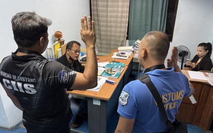 <p><strong>CHARGED. </strong> Customs personnel appear during the Inquest Proceedings at the City Prosecutor's Office in Navotas City on Saturday (Sept. 21, 2024).  They filed multiple complaints against the owners and crew of two vessels involved in oil smuggling. <em> (BOC photo)</em></p>