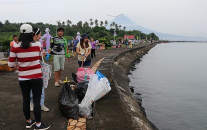 <p><strong>FIGHT VS. POLLUTION.</strong> Volunteers collect waste along the shorelines of Barangays Lamba, Puro, and Dapdap in Legazpi City on Saturday (Sept. 21, 2024). The activity was part of the celebration of International Coastal Cleanup (ICC) Day led by the Department of Environment and Natural Resources (DENR) in Bicol <em>(Photo courtesy of DENR-Bicol)</em></p>