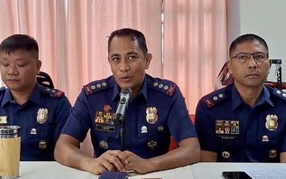 <p><strong>REWARD MONEY</strong>. P/Col. Frederick E. Obar (center), provincial director of the Ilocos Norte Police Provincial Office announced on Monday (Sept. 23, 2024) that a PHP300,000 reward is being offered for any information on the perpetrators behind the killing of Barangay 5 San Silvestre village chief Francisco Bagay Jr.. The village official was sitting at the garage of his house when an assailant shot him several times with a .45 caliber pistol at 6:25 p.m. on Sept. 20, 2024. <em>(Screenshot from INPPO FB live)</em></p>