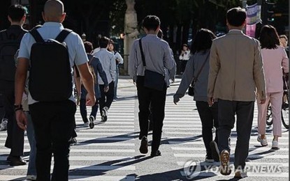 <p>This file photo taken Sept. 23, 2024 shows people on street at Gwanghwamun in Seoul. <em>(Yonhap)</em></p>