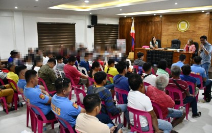 <p><strong>FOREST RANGERS</strong>. Some of the former rebels deputized as forest guards in Borongan City, Eastern Samar during a meeting on Sept. 17, 2024. Their employment is part of the city government’s initiative to fight insurgency and protect the environment. <em>(Photo courtesy of Borongan City government)</em></p>