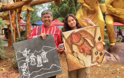 <p><strong>SOIL ART.</strong> Chieftain Rodelio "Waway" Saway (left) of the Talaandig tribe collaborates with visual artist MayyA to showcase artwork made from soil paint. Saway envisions Bukidnon as the "Soil Painting Capital of the World" and is targeting a Guinness World Record. <em>(Photo courtesy of MayyA Creatives)</em></p>