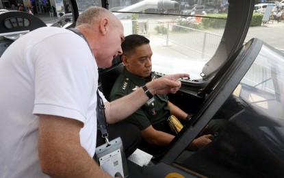 <p><strong>FIGHTER JET.</strong> Armed Forces of the Philippines Chief of Staff Romeo Brawner Jr. sits in the cockpit of a Saab JAS 39 Gripen, during the 5th Asian Defense and Security (ADAS) Exhibition at the World Trade Center in Pasay City on Wednesday (Sept. 25, 2024). A Saab JAS 39 Gripen is a light single-engine supersonic multirole fighter aircraft built by Swedish aerospace and defense company Saab AB. <em>(PNA photo by Yancy Lim)</em></p>