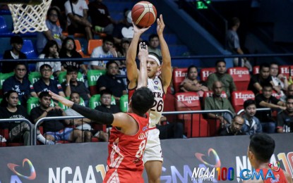 <p><strong>SCORE.</strong> Letran's Sherick Estrada (No. 26) scores on a jumper against Emilio Aguinaldo College's JC Luciano during the National Collegiate Athletic Association (NCAA) Season 100 men's basketball tournament at the Filoil EcoOil Arena in San Juan on Wednesday (Sept. 25, 2024). The Letran Knights won, 75-73. <em>(NCAA photo)</em></p>