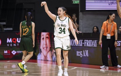 <p><strong>HOT HAND.</strong> De La Salle University's Luisa San Juan (No. 34) reacts after firing a three-pointer during the game against Far Eastern University in the UAAP Season 87 women's basketball tournament at the Smart Araneta Coliseum on Wednesday (September 25, 2024). The Filipino-British guard sank a league record of 10 triples in a game in leading the Lady Archers to an 89-65 victory. <em>(UAAP photo)</em></p>