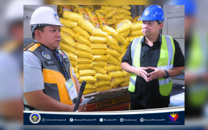 <p>Customs Commissioner Bienvenido Rubio and House Speaker Martin Romualdez inspect rice shipments at the Manila International Container Port on Sept. 25, 2024. <em>(Photo courtesy of BOC)</em></p>