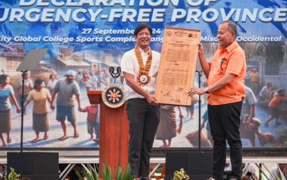 <p><strong>INSURGENCY-FREE.</strong> President Ferdinand R. Marcos Jr. attends the celebration of the declaration of Misamis Occidental as an insurgency-free province in a ceremony in Tangub City on Friday (Sept. 27, 2024). Marcos also led the distribution of financial assistance to former rebels. <em>(Photo courtesy of the Presidential Photojournalists Association)</em></p>