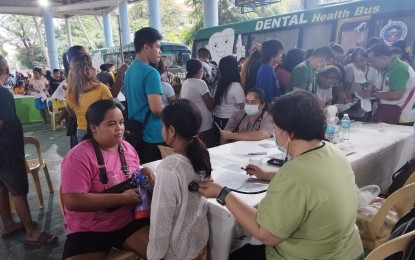 <p><strong>CHECK-UP</strong>. A medical practitioner checks on a patient during the Department of Health's PuroKalusugan Program at the Arenas Civic Center in Malasiqui, Pangasinan on Monday (Sept. 30, 2024). The program offered medical consultation, dental services, laboratories, ECG, X-ray, ultrasound, and provision of medicines and vaccines among others, benefiting around 3,000 residents. <em>(Photo by Hilda Austria)</em></p>