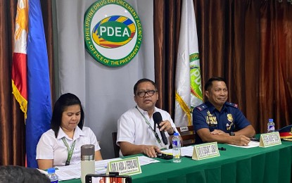 <p><strong>ACCOMPLISHMENT.</strong> Philippine Drug Enforcement Agency in Bicol (PDEA-5) Regional Director Edgar Jubay (center) and Police Regional Director Brig. Gen. Andre Dizon (right) speak at a press conference at the PDEA office in Camp Ola, Legazpi City, on Monday (Sept. 30, 2024). They reported the seizure of 18 kilograms of shabu worth PHP92.5 million at Matnog Port, Sorsogon, on Sept. 28. <em>(PNA photo by Connie Calipay)</em></p>