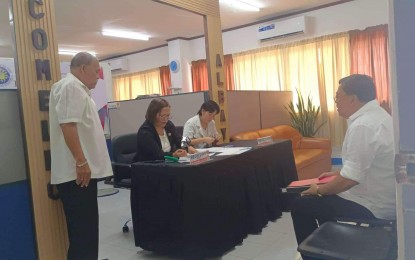 <p><strong>FILING OF CANDIDACY.</strong> Personnel of the Commission on Elections (Comelec) in Albay check the certificate of candidacy of a political aspirant filed through his representative at the Capitol Annex Building in Legazpi City on Tuesday (Oct. 1, 2024). Comelec-Albay urged all those running for various positions not to wait until the last day on Oct. 8 to file their COC.<em> (Contributed photo)</em></p>