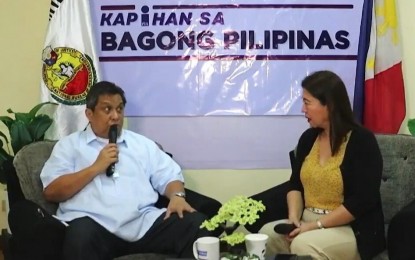 <p><strong>NO TO SCAMMERS</strong>. National Bureau of Investigation-Central Visayas Director Renan Oliva discusses the achievements of the Regional Office during the Kapihan sa Bagong Bagong Pilipinas forum hosted by Philippine Information Office (PIA)-7 head Fayette Rinen on Tuesday (Oct. 1, 2024). Oliva urged would-be investors not to transact with online fixers to avoid being scammed.<em> (Screenshot from PIA-7 video)</em></p>