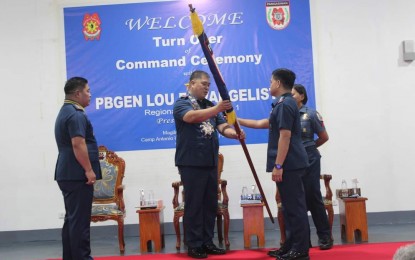 <p><strong>TURNOVER OF COMMAND</strong>. Ilocos Police Regional Office director Brig. Gen. Lou Frias Evangelista (middle) hands the flag of the Pangasinan Police Provincial Office (PPPO) to  its new director, Col. Rollyfer Capoquian (right), in a ceremony on Tuesday (Oct. 1, 2024) at the PPPO’s Magilas Hall in Lingayen town, Pangasinan. Capoquian, who replaced Col. Jeff Fanged, plans to utilize technological innovations to prevent and solve crimes. <em>(Photo courtesy of PPPO) </em></p>