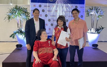 <p><strong>REELECTION BID. </strong>Reelectionist Senator Imee Marcos (2nd from right) files her certificate of candidacy (COC) on the second day of the filing period at The Manila Hotel Tent City on Wednesday (Oct. 2, 2024). The presidential sister was accompanied by former First Lady Imelda (2nd from left) and her sons Borgy (left) and Michael (right). <em>(PNA photo by Ferdinand Patinio)</em></p>