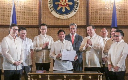 <p><strong>VAT LAW</strong>. President Ferdinand R. Marcos Jr. signs the Value Added Tax (VAT) on Digital Services Law at Malacañan Palace on Wednesday (Oct. 2, 2024). Republic Act 12023 imposes a 12-percent VAT on foreign digital service providers, such as Netflix, Spotify, Disney, and HBO, to generate additional revenue for the government and level the playing field for local providers. <em>(Presidential Photojournalists Association)</em></p>