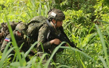 <p><strong>'KATIHAN' PATROL.</strong> Participants navigate the thick foliage during the "Katihan" Patrol tilt held in Camp Tecson, San Miguel, Bulacan from Sept. 25 to Sept. 30, 2024. The Philippine Army on Wednesday (Oct. 2, 2024) said the First Scout Ranger Regiment emerged as champions of the competition's inaugural edition. <em>(Photo courtesy of the PA)⁩</em></p>