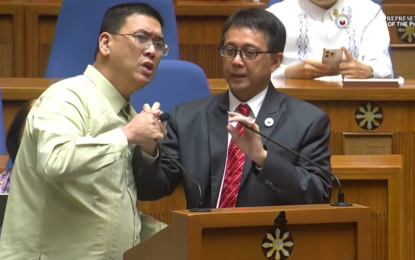 <p><strong>UNPARLIAMENTARY</strong>. Agri Party-list Representative Wilbert Lee interrupts Northern Samar 1st District Rep. Paul Daza’s motion to terminate the interpellation period by grabbing the microphone from him during the plenary deliberation on the Department of Health's proposed 2025 budget on Sept. 25, 2024. BHW party-list Rep. Angelica Natasha Co on Wednesday (Oct. 2) urged the House Ethics Committee to formally investigate Lee's "unparliamentary conduct". <em>(Screengrab)</em></p>