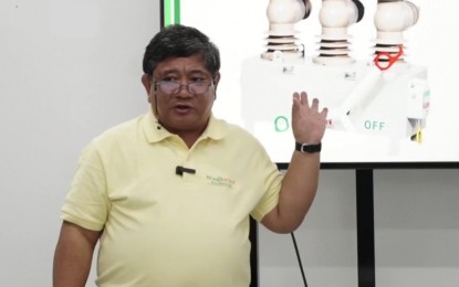 <p><strong>POWER TALK.</strong> Negros Electric and Power Corp. president and chief executive officer Roel Castro explains the installation of automatic circuit reclosers (ACR) in its distribution system covering the cities of Bacolod, Bago, Talisay, and Silay, as well as the municipalities of Murcia and Don Salvador Benedicto. “With this introduction of ACR in the system, we believe the number of feeder level outage will be reduced. It will lessen the affected customers,” Castro said in a press conference at the Negros Power office in Bacolod City on Tuesday (Oct. 2, 2024). <em>(Screenshot from Negros Power Facebook Live)</em></p>