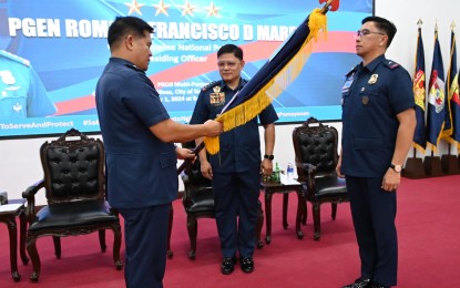 <p><strong>NEW TOP COP.</strong> Outgoing Police Regional Office (PRO) 3 (Central Luzon) chief, Brig. Gen. Jose Hidalgo Jr. (left) turns over the PRO-3's flag to his successor, Brig. Gen. Redrico Maranan (right) during the change of command rites at the PRO-3 headquarters in Camp Olivas, San Fernando City, Pampanga on Tuesday (Oct. 1, 2024). Maranan promised to continue the implementation of the PNP's key programs. <em>(Photo courtesy of PNP Public Information Office)</em></p>