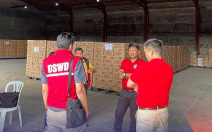 <p><strong>DSWD WAREHOUSE</strong>. Employees of the Department of Social Welfare and Development (DSWD) chat in a warehouse in this undated photo. The DSWD on Thursday (Oct. 3, 2024) said it now has 981 storage facilities nationwide that are being used for faster disaster response. <em>(DSWD photo)</em></p>