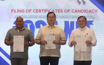 <p style="text-align: left;"><strong>MORE ASPIRANTS</strong>. Senators Ronald Dela Rosa (from left), Christopher Lawrence Go and actor Phillip Salvador file their certificates of candidacy (COCs) before the Commission on Elections at the Manila Hotel Tent City on Thursday (Oct. 3, 2024). Dela Rosa and Go are reelectionists. <em>(PNA photo by Avito Dalan)</em></p>