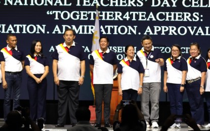 <p><strong>HONORING TEACHERS.</strong> President Ferdinand R. Marcos Jr. (4th from left), Speaker Ferdinand Martin Romualdez (3rd from left), First Lady Liza Araneta Marcos (5th from left) and Education Secretary Sonny Angara (3rd from right) grace the culmination activity of Teachers' Month at the Araneta Coliseum in Cubao, Quezon City Thursday (Oct. 3, 2024). In his speech, Angara highlighted the need to love and honor Filipino teachers as they are the heart of the country's education system. <em>(PNA photo by Jess Escaros)</em></p>