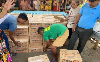 <p><strong>FOOD AID.</strong> Thirty-seven members of the Badjao community in Tandag City, Surigao del Sur receive family food packs from the DSWD-13 on Oct. 3, 2024, after completing community gardening work under the agency’s Food-for-Work program. In a separate distribution, 1,105 residents of San Agustin town also received food packs after participating in various community service projects. <em>(Photo courtesy of DSWD-13)</em></p>