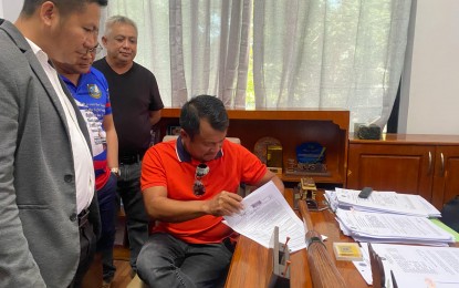 <p><strong>COC FILING.</strong> Pryde Henry Teves (sitting) files his certificate of candidacy for the position of governor of Negros Oriental in the 2025 midterm elections, on Friday (Oct. 4, 2024) at the Commission on Elections (Comelec) office in Dumaguete City. Teves was elected and proclaimed governor in 2022 but the Comelec annulled his proclamation following a vote recount.<em> (Photo courtesy of Mary Joy Tubis)</em></p>