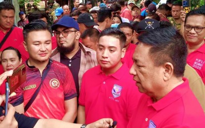 <p><strong>BASILAN ASPIRANTS.</strong> Basilan Governor Hadjiman Hataman-Salliman (right) speaks to reporters after filing his certificate of candidacy (COC) with his son, 2nd District Board Member Jimael Salam (center), at the provincial election office in Isabela City on Friday (Oct. 4, 2024). Vice Mayor Kifli Hataman-Salliman (left), the governor’s youngest son, filed his COC for mayor of Isabela City on Thursday (Oct. 3, 2024). <em>(Photo by Teofilo P. Garcia Jr.)</em></p>