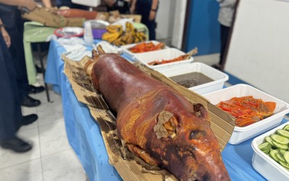 <p><strong>FEAST.</strong> Two pork lechon are awarded by the Iloilo City Government on Friday (Oct. 4, 2024) to the Iloilo City Police Station 1 (ICPS 1) after it was named the best-performing police station in anti-drug campaign accomplishments for September. The city government has committed to honoring and rewarding the best-performing police station in this critical battle, the mayor's spokesperson, Joy Fantilaga, said. <em>(Photo courtesy of Joy Fantilaga)</em> </p>