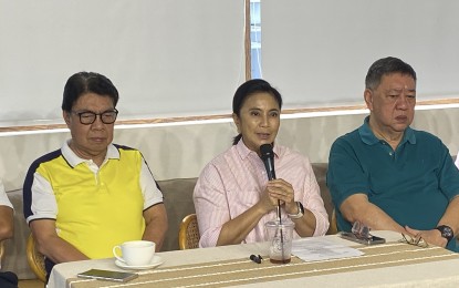 <p><strong>MAYORAL BID</strong>. Former Vice President Leni Robredo (center) confirms her bid for mayor of Naga City in the 2025 midterm elections in a press conference at Pandawan Restaurant in Naga City on Friday (Oct. 4, 2024). Robredo and the Team Naga line-up will file their certificates of candidacy on Saturday (Oct. 5). <em>(PNA photo by Connie Calipay)</em></p>