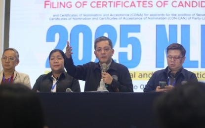 <p><strong>FIFTH DAY.</strong> Commission on Elections (Comelec) chairperson George Erwin Garcia (3rd from left) answers queries from the press during the close of the fifth day of the filing of the certificates of candidacy for the 2025 midterm elections at the Manila Hotel Tent City on Saturday (Oct. 5, 2024). Garcia said 12 aspiring senators and 23 party-list groups filed their COCs during the day. <em>(PNA photo by Avito Dalan)</em></p>