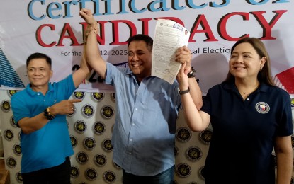 <p><strong>ENDORSEMENT.</strong> Negros Occidental Vice Governor Jeffrey Ferrer (center) is accompanied by Abang Lingkod Party-list Rep. Stephen Joseph Paduano (left) and wife, 4th District Rep. Juliet Marie Ferrer, in filing his certificate of candidacy at the Commission on Elections provincial office in Bacolod City Sunday afternoon (Oct. 6, 2024). Ferrer eyes to succeed his wife and will have as rival Lea Delfinado, the Nationalist People's Coalition bet and former assistant secretary of the Department of Human Settlements and Urban Development. <em>(PNA photo by Nanette L. Guadalquiver)</em></p>