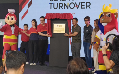 <p><strong>SUPPORT FOR SPORT</strong>. Education Secretary Sonny Angara (5th from left) joins the presentation of pledge through a marker symbolizing the partnership between the National Sports Academy and Jollibee Foods Corp. in Capas, Tarlac on Monday (Oct. 7, 2024). Jollibee announced a PHP5 million pledge to the NAS to boost the preparation of the national athletes for future competitions. <em>(Photo by Ivan Saldajeno)</em></p>