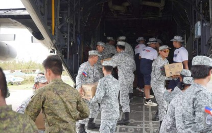 <p><strong>HELPING HAND.</strong> Military personnel unload relief supplies from a C-130 aircraft in Batanes province in this undated photo. The Office of Civil Defense on Monday (Oct. 7, 2024) said it is working with various government agencies and the uniformed services to ensure maximum logistical support to relief operations in the typhoon-hit province.<em> (Photo courtesy of the OCD)</em></p>