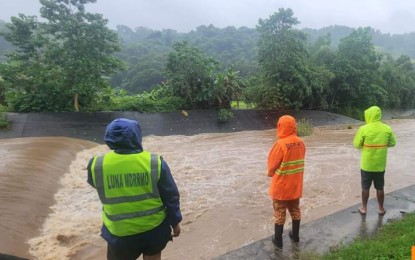 <p><strong>ON WATCH</strong>. Local officials monitor the river in Luna town, La Union on Sept. 30, 2024 during the onslaught of Typhoon Julian in the province. The typhoon left PHP17.8 million initial damage to agriculture in La Union. <em>(Photo courtesy of MDRRMO Luna)</em></p>