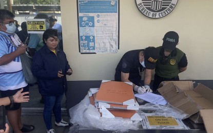 <p><strong>DANGEROUS ART.</strong> Philippine Drug Enforcement Agency agents make an inventory of shabu found hidden in handmade paintings inside a cargo warehouse at the Ninoy Aquino International Airport complex in Pasay City on Tuesday (Oct. 8, 2024). The contraband was worth an estimated PHP111 million. <em>(Photo courtesy of PDEA)</em></p>