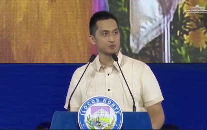 <div dir="auto"><strong>OPEN FOR BUSINESS</strong>. Ilocos Norte Governor Matthew Joseph Manotoc announces during his State of the Province Address on Tuesday (Oct. 8, 2024) that Ilocos Norte is open for business. He also enjoined global Ilocanos to share their expertise and invest in Ilocos Norte to promote inclusive growth. <em>(Screengrab from FB live)</em></div>