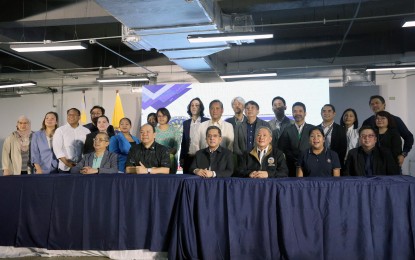 <p><strong>SOURCE CODE REVIEW.</strong> Officials of the Commission on Elections and other stakeholders pose for a photo during their visit to the Circuit Corporate Center One in Makati City on Friday (Oct. 11, 2024). The review of the automated election system that would be used in next year's midterm polls will start on Oct. 14. <em>(PNA photo by Yancy Lim)</em></p>