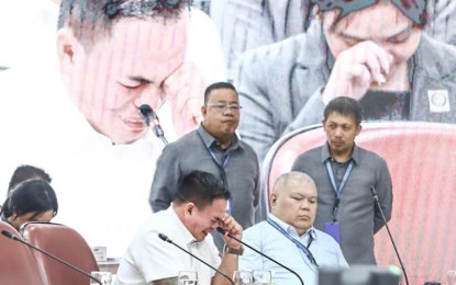 <p><strong>NEW TWIST</strong>. Self-confessed drug lord Kerwin Espinosa cries while giving his testimony during the eighth public hearing of the House of Representatives quad committee on Friday (Oct. 11, 2024). Espinosa claimed that former president Rodrigo Duterte ordered the 2016 killing of his father, Albuera Mayor Rolando Espinosa. <strong><em>(PNA photo by Joan Bondoc)</em></strong></p>